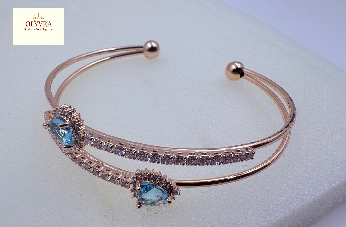 Rose gold-plated sky-blue stones open bangle |Olyvra