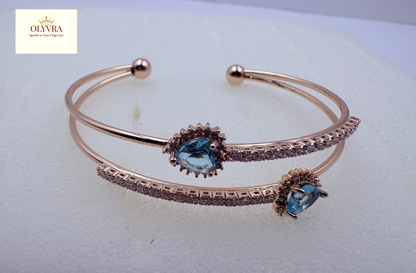 Rose gold-plated sky-blue stones open bangle |Olyvra